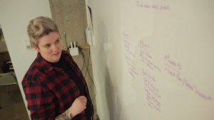 An employee writing on a whiteboard