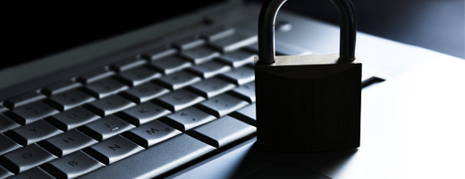 A padlock on top of a laptop’s keyboard.